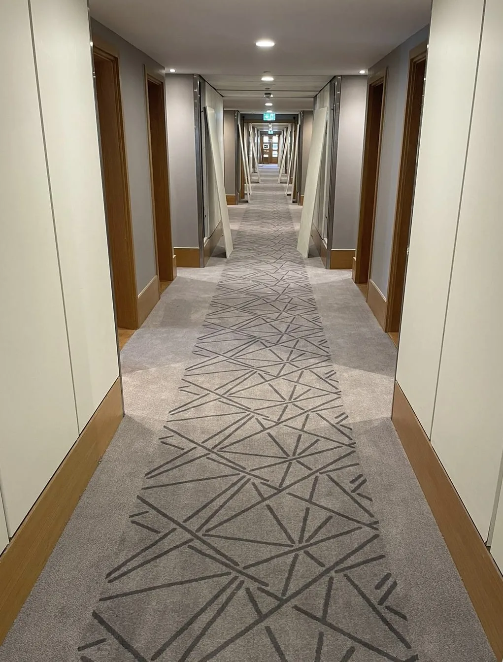 JLN patterned carpet fitted along a long commercial corridor